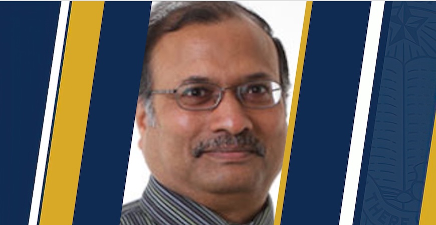 Photo depicts Professor Mukesh Singhal on a blue and gold background. 