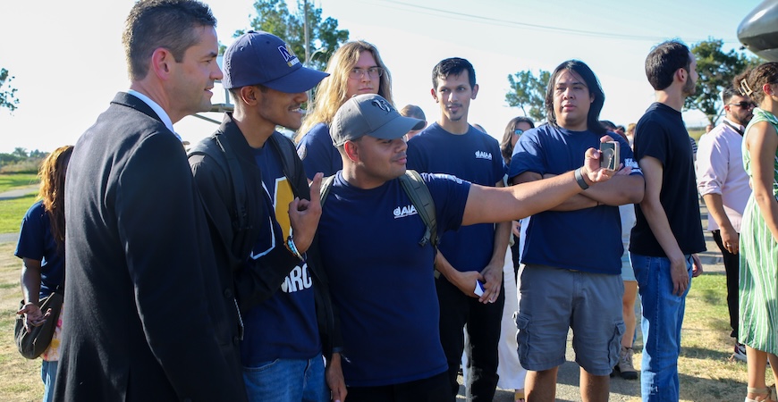 NASA Administrator Jared Isaacman takes a photo with UC Merced students Rayan Dua and Samir Ahmed. 